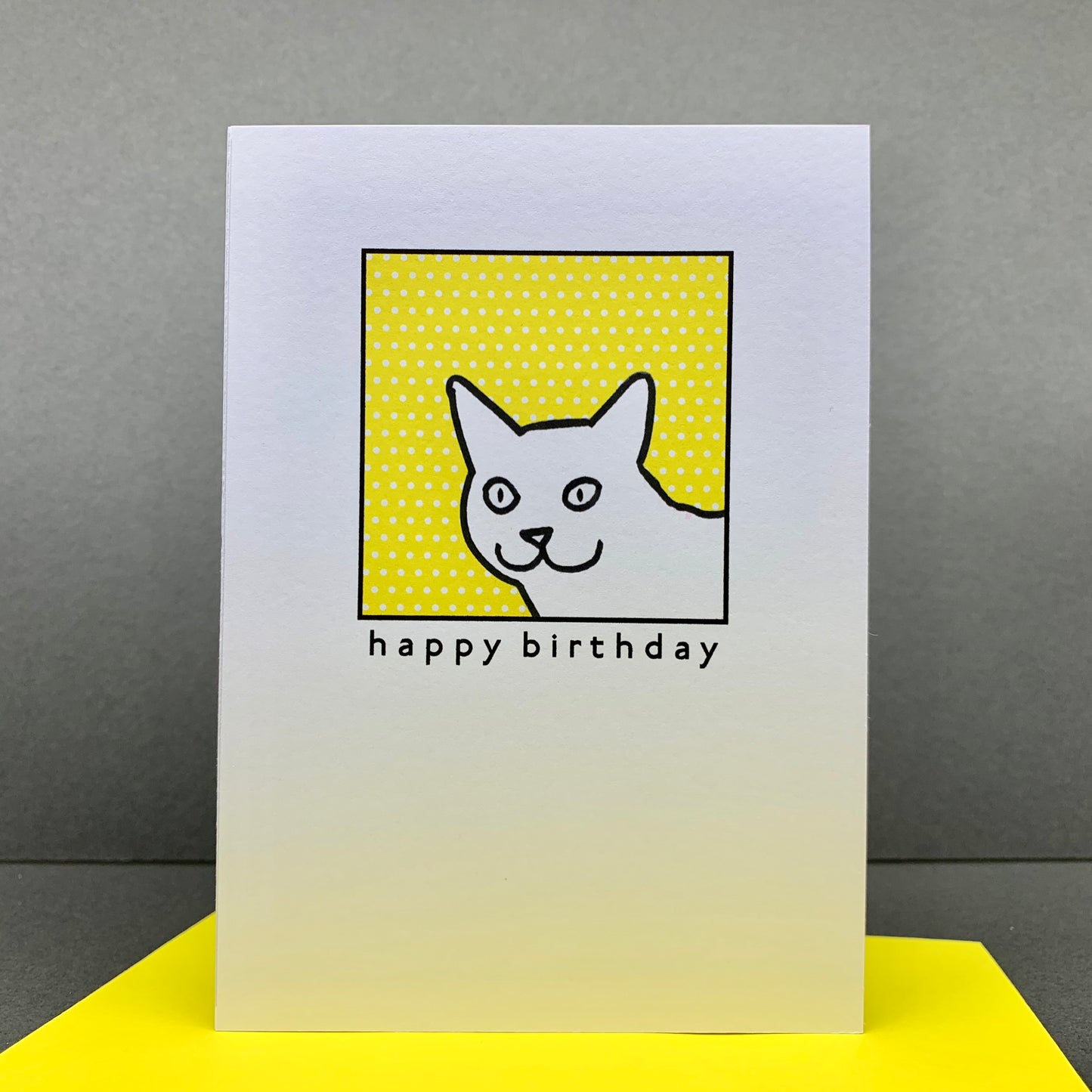 Cat on yellow polka dots